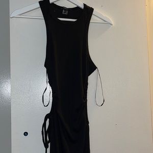 Black summer long dress. Has 2 styled openings on right and left. Never worn.
